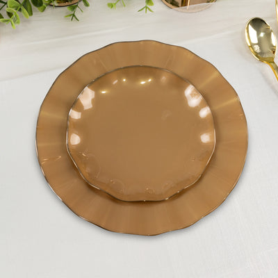 Brown scalloped dinner and salad plates stacked on a table.