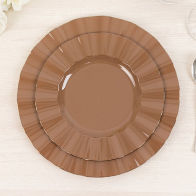 Brown decorative plates stacked together on a light surface.