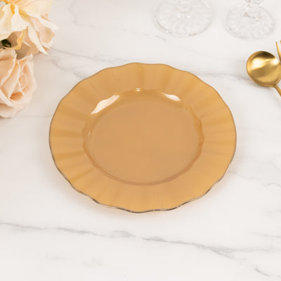 Elegant gold-rimmed dessert plate on a marble surface.