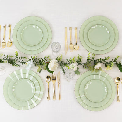 Elegant green dinner plates set for a dining table with floral decor.