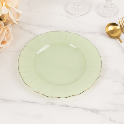 Light green decorative plate with scalloped edges and gold trim.