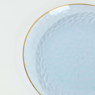 Light blue decorative plate with a textured surface and gold rim.