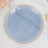 Blue marble-patterned plate with gold rim on a marble surface.