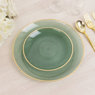 Green decorative plate with gold rim on a light wooden surface.