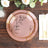 Elegant pink floral plates set on a rustic wooden table.