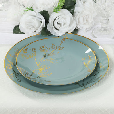 Elegant turquoise plates with gold floral design on a textured table setting.