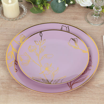 Elegant lavender plates with floral design and gold accents on a wooden table.