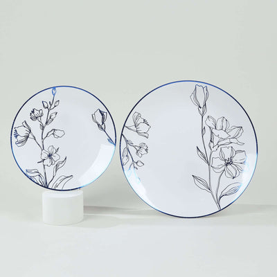 Elegant floral-patterned plates in two sizes on a neutral background.