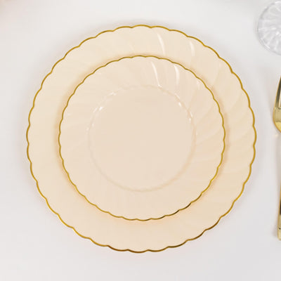Elegant scalloped dinner plates in soft peach with gold trim.