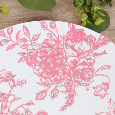 Pink floral patterned plate on a wooden surface.