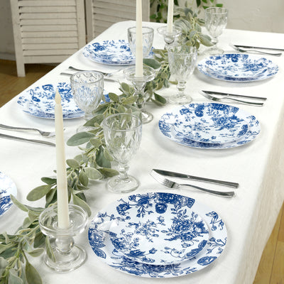 Elegant blue and white floral dinnerware set on a beautifully arranged dining table.
