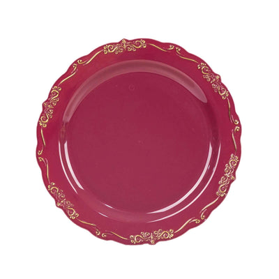 Elegant burgundy plate with gold accents, perfect for dining.