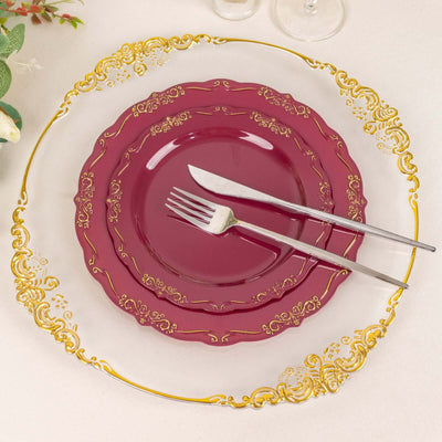 Elegant burgundy and gold dinner plate set with fork and knife