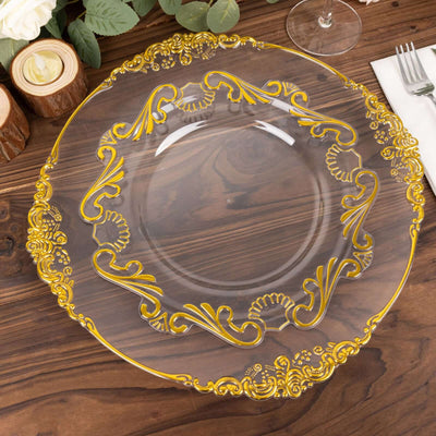Elegant clear charger plate with gold detailing on a wooden table setting.