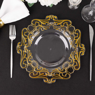 Elegant gold-accented clear decorative plate on a black table setting.