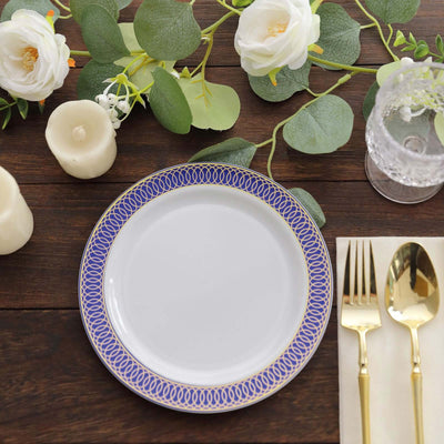 Elegant white plate with blue pattern, surrounded by flowers and candles.