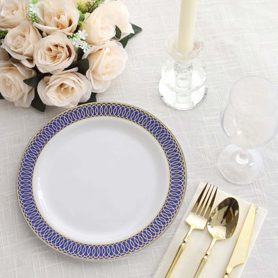Elegant white plate with blue and gold detailing, set on a dining table.
