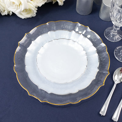 Elegant layered plates with a gold rim on a dark table setting.