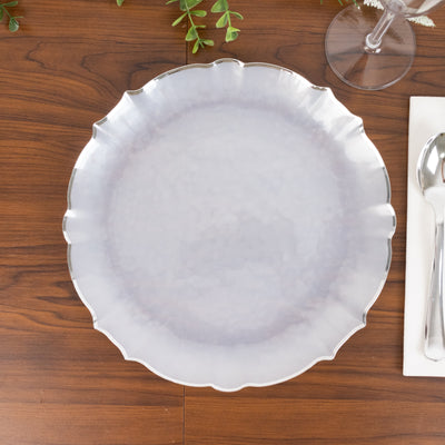 Elegant scalloped edge plate on wooden table setting.