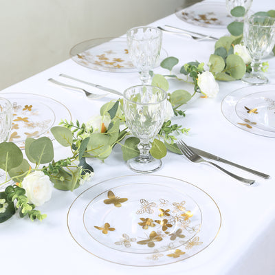 Elegant gold butterfly dinnerware set on a beautifully arranged table.