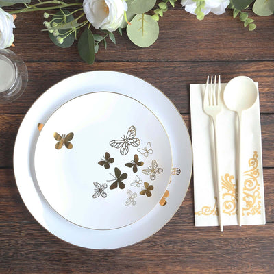 Elegant butterfly design dinner plate with gold accents on a wooden table setting.
