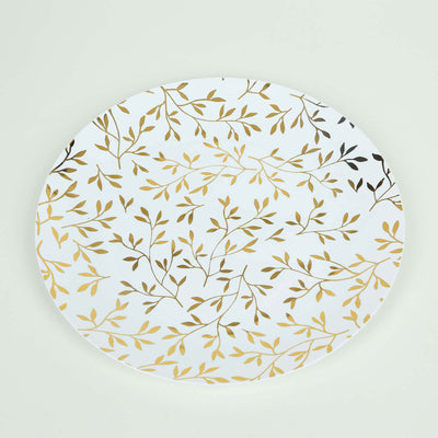 Decorative white plate with gold leaf pattern on a plain background