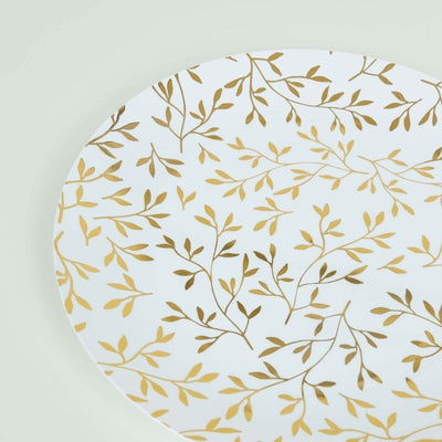 White plate with gold leaf pattern on a light background.