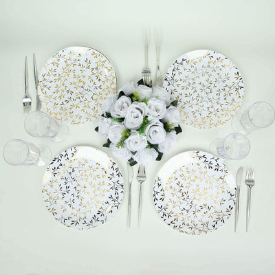Elegant table setting with floral patterned plates and glassware.
