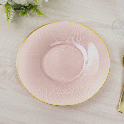 Pink decorative plate with golden rim and textured design.