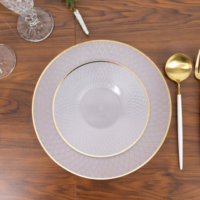 Elegant purple and gold dinner plates stacked on a wooden table.