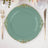 Elegant teal plate with ornate gold trim on a dining table setting.