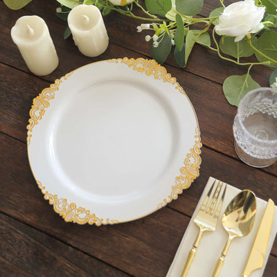 Elegant white plate with gold floral trim on a rustic wooden table setting.
