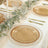 Elegant glass dinner plates with gold beaded rim on a beautifully set table.