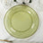 Green glass plate with decorative beaded rim on a textured tablecloth.