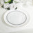Elegant white plate with black beading and gold rim on a table setting.