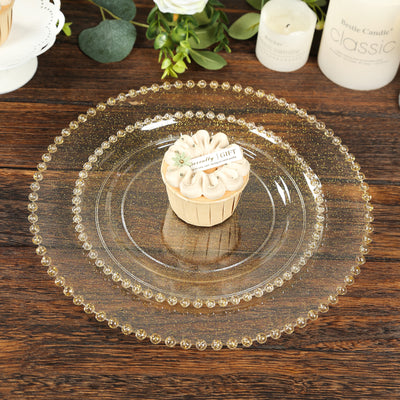 Elegant glass serving platter set with decorative beaded rim and cupcake.