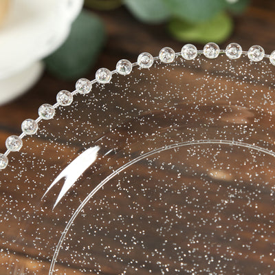 Clear decorative plate with sparkling details and beaded edge.