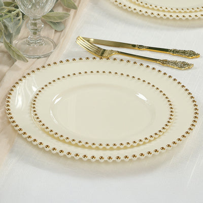 Elegant ivory dinner plate set with gold beaded rim