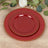 Red decorative plates with gold beading, stacked elegantly on a wooden surface.