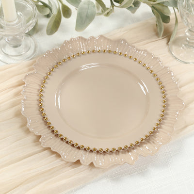 Elegant beige plate with a ruffled edge and gold bead trim.
