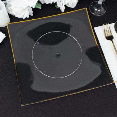Black serving plate with clear center and gold trim, perfect for elegant dining.