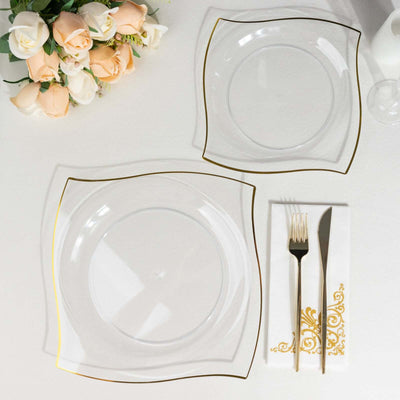 Elegant clear plates with gold trim, styled for a dining setting.