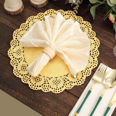Elegant yellow lace placemat with a folded napkin and silverware.