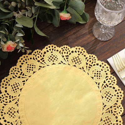 Gold lace table placemat on a wooden table with floral decor.