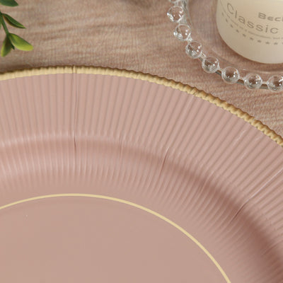 Pink decorative plate with textured edges and gold trim.