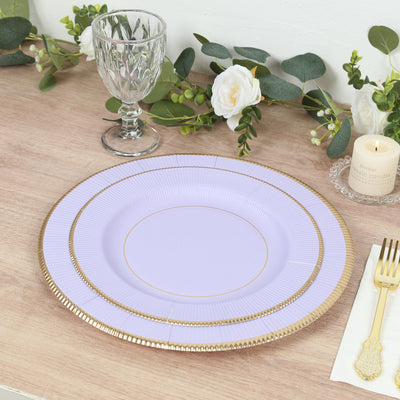 Elegant lavender plate with gold rim on a rustic table setting.