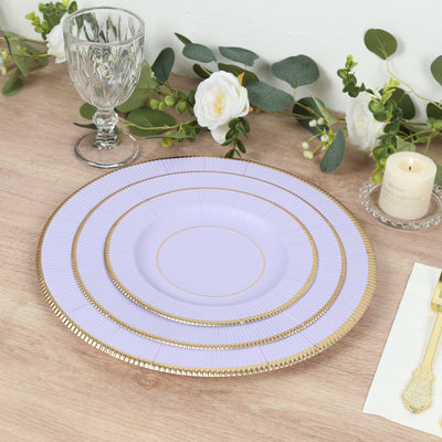 Lavender decorative plate with gold accents on a wooden table setting.