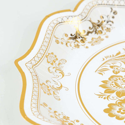 Elegant gold and white decorative plate with intricate floral design.