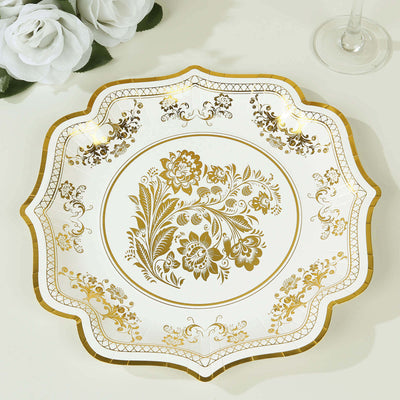 Decorative gold floral plate on white background