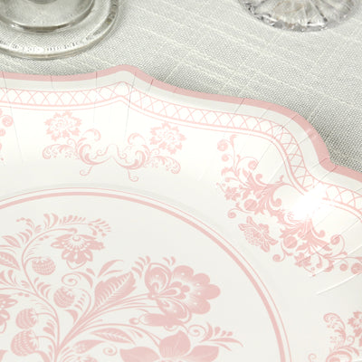 Elegant pink floral paper plate with a scalloped edge.